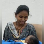 women with baby gives 12th exams