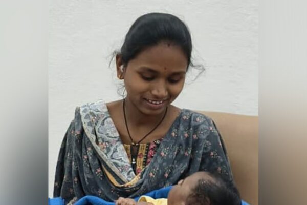 women with baby gives 12th exams