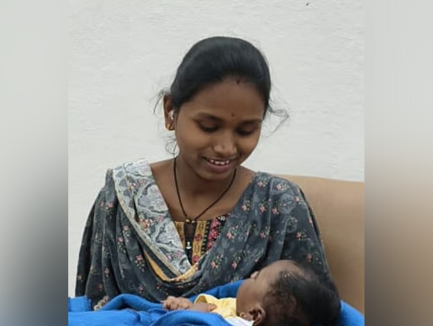 women with baby gives 12th exams