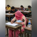 women with baby gives 12th exams