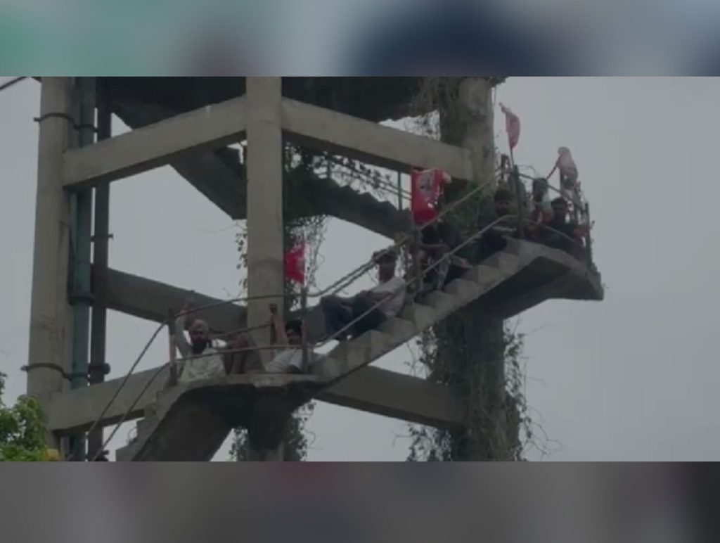 Nine Meter Readers Protest Atop Water Tank In Patiala Over Job Demands