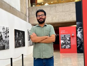 A heritage enthusiast stands inside a Partition history exhibition, surrounded by archival photographs and displays documenting the experiences and memories of Partition-era Punjab. (Photo Credit: Manjari Verma)